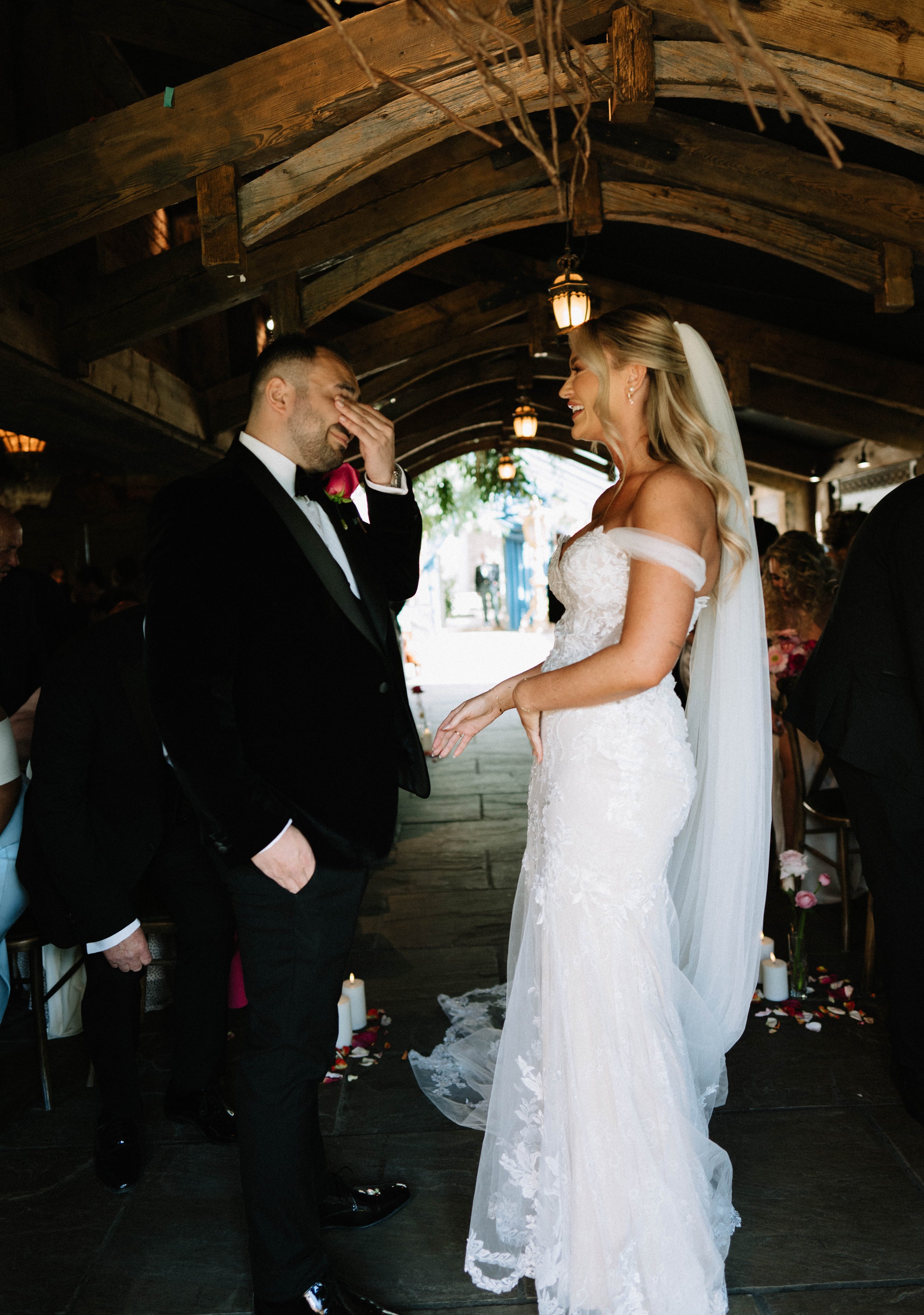 Bride and groom ceremony groom happy tears