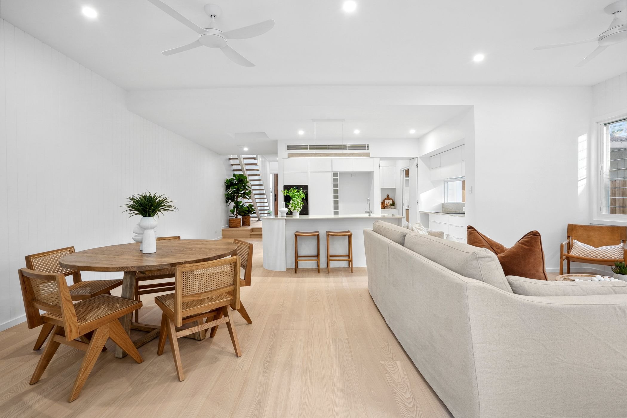 Custom designed duplex project in Port Macquarie features modern open-plan living, dining and kitchen areas with walk in butler's pantry.