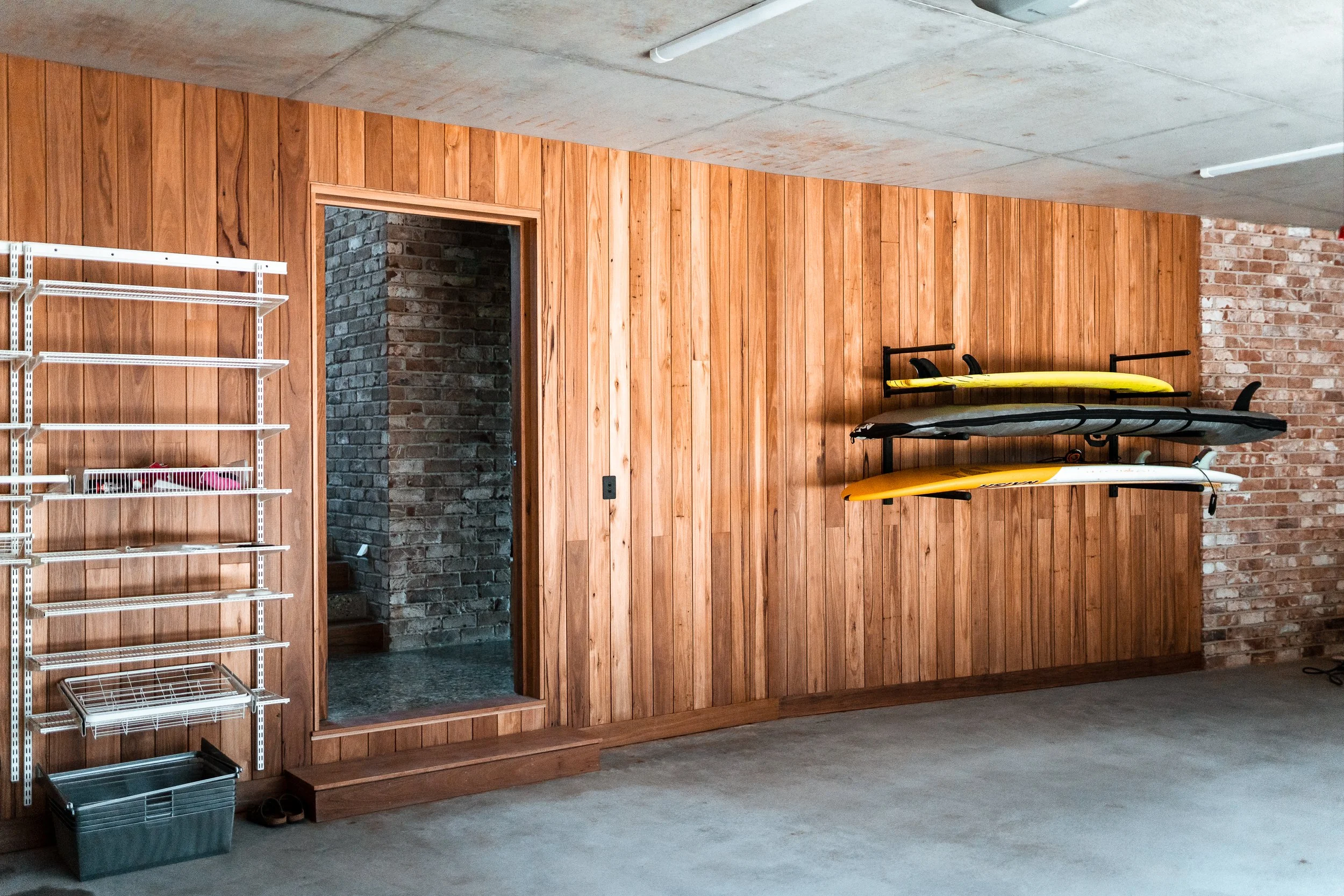 Timber panelling on feature wall in garage of luxury residential construction project in Port Macquarie.