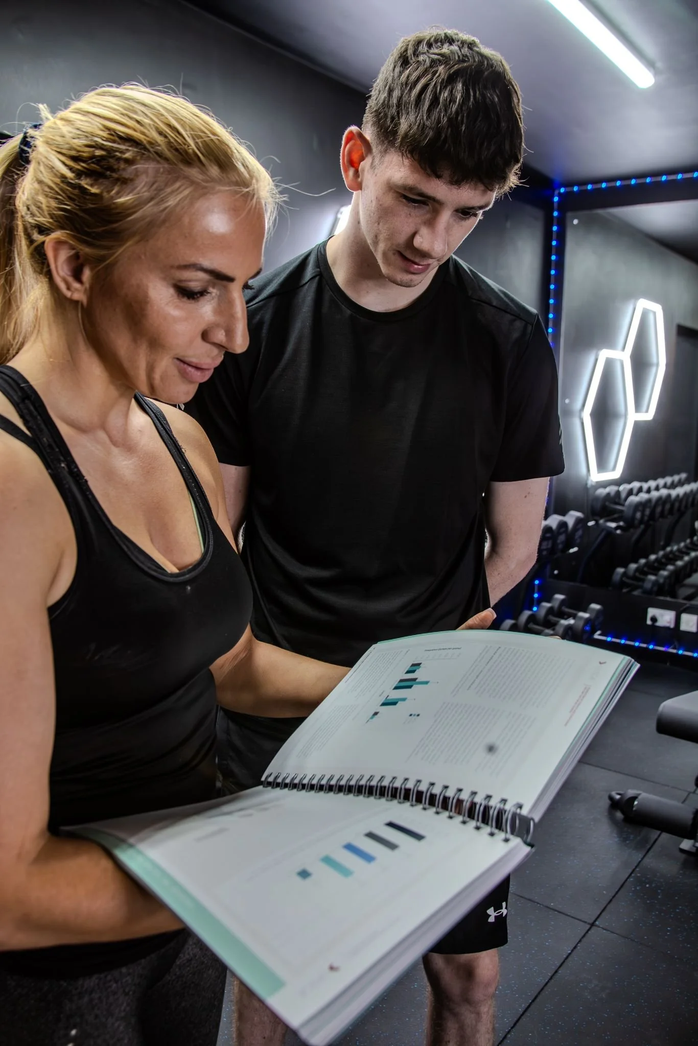 Strength and Conditioning course students reading a manual