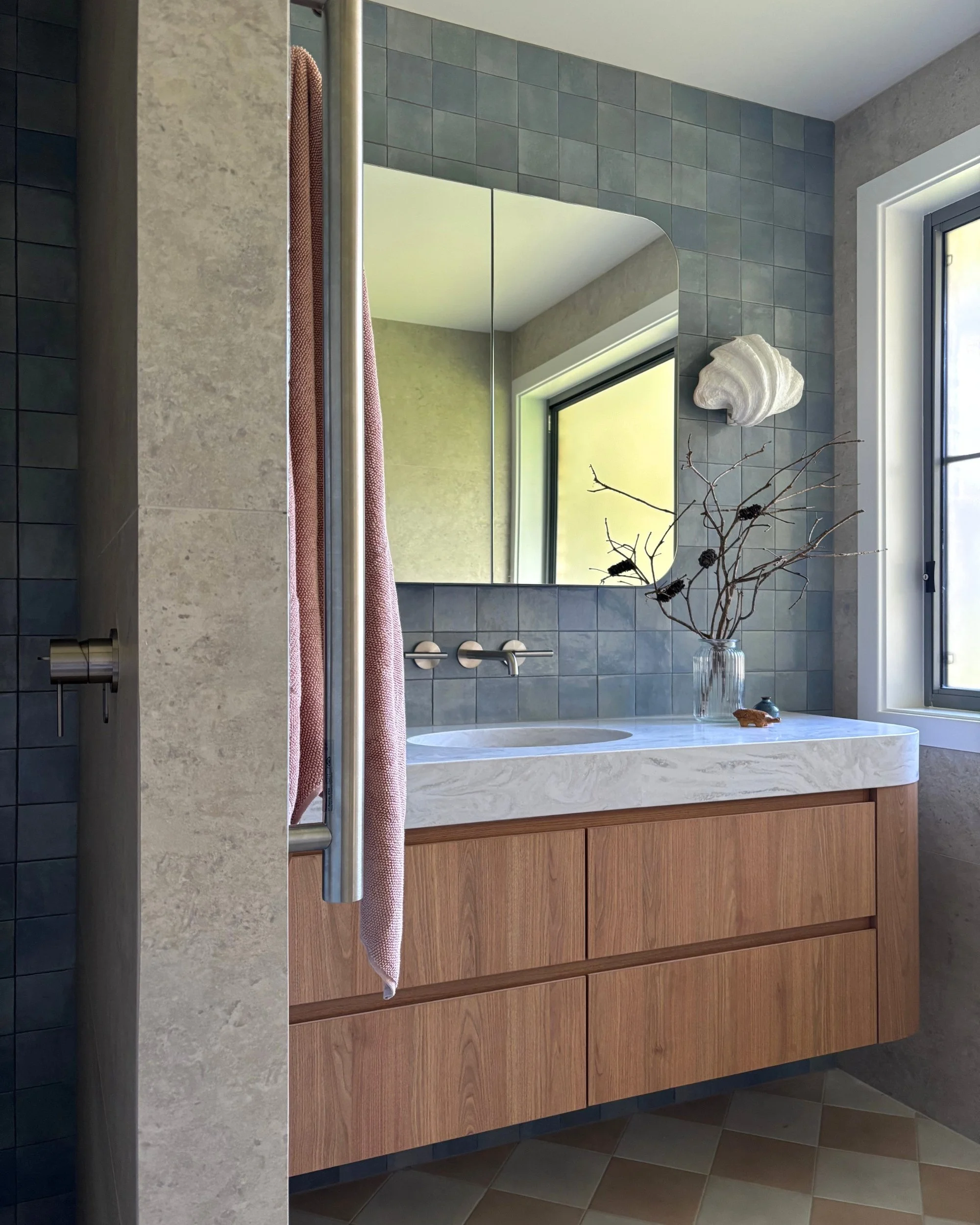 Bathroom with custom timber vanity, blue handmade tiles and checkerboard floor in Hungry Head NSW