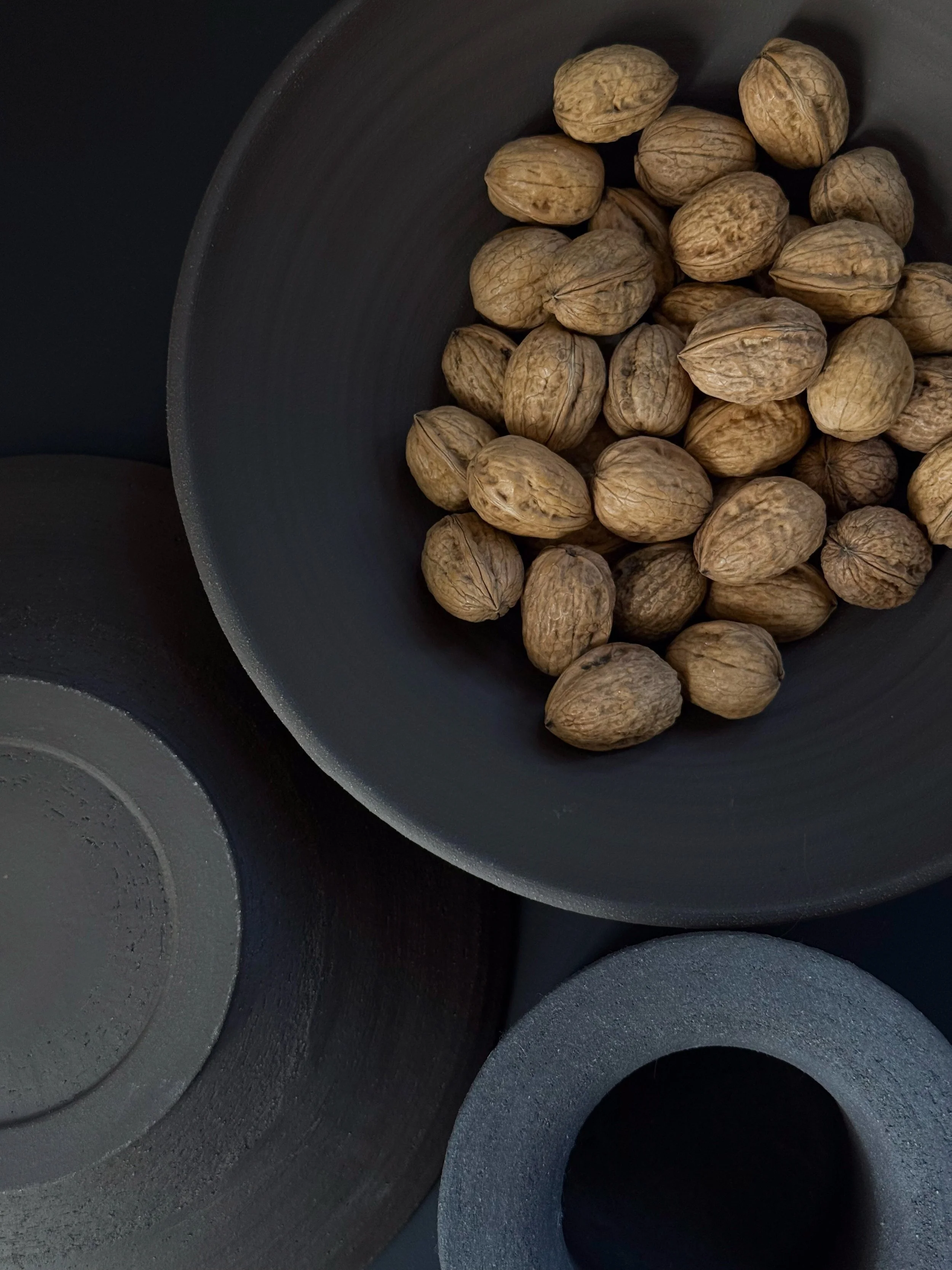 Warm, robust, and timeless. Crafted from textured stoneware clay in a rich deep brown, this fruit bowl carries the marks of careful handwork. Its simple, organic shape brings natural elegance to any kitchen or dining table. 

Measurements 8 cm high x