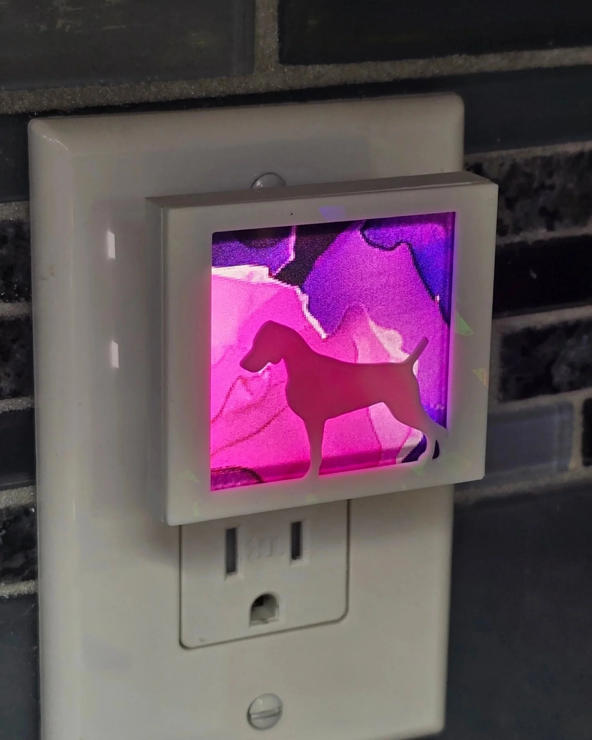 Plug in nightlight, white Weimaraner cover over pink and purple patterned acrylic