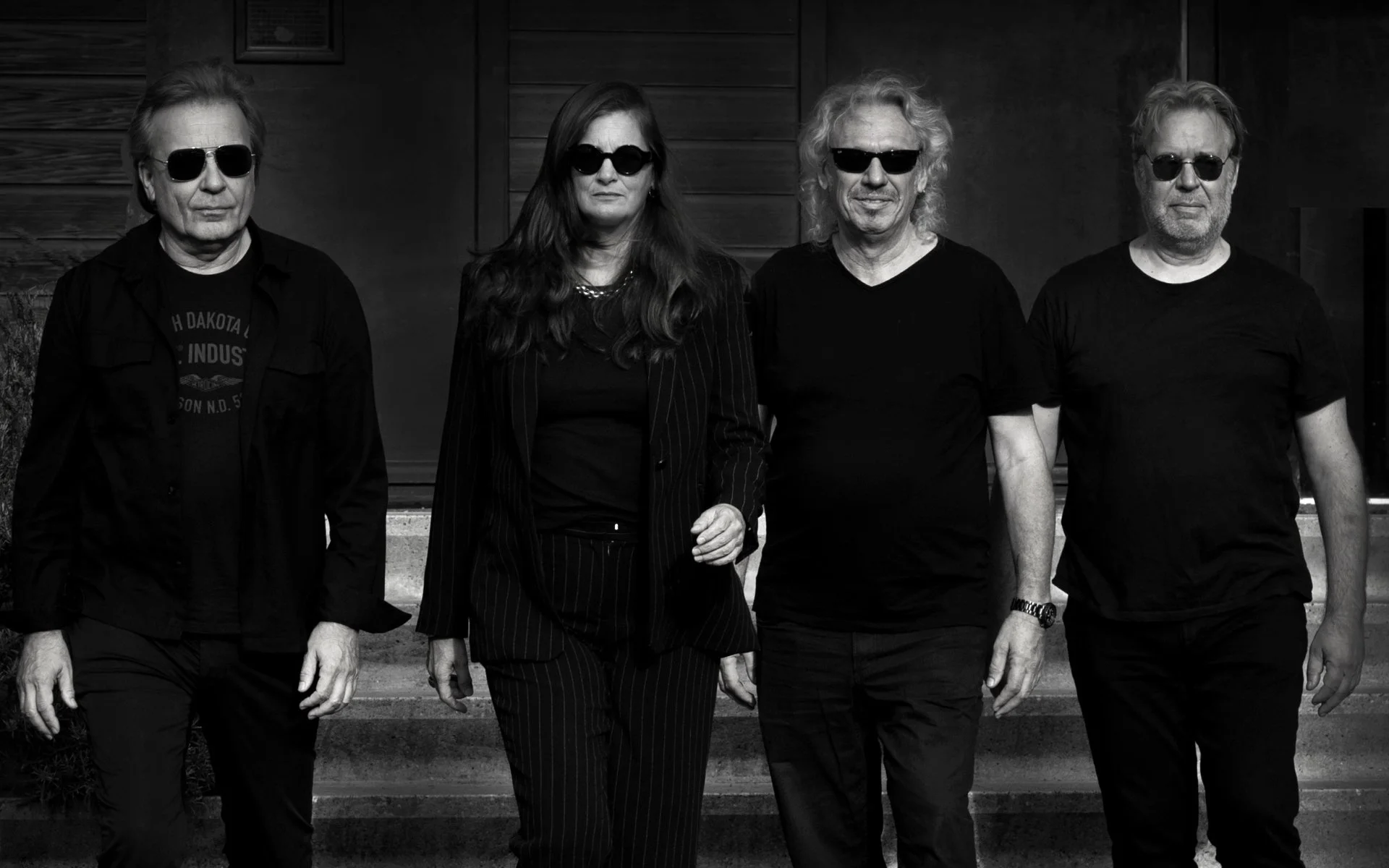 the bush bandits band picture 4 people wearing black posing outside