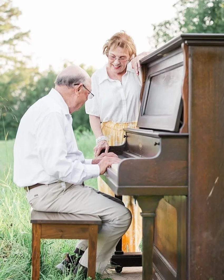 Some love stories don&rsquo;t rush.
They linger&hellip; they soften&hellip; they deepen with time.

Watching these two sit side by side, playing the piano in the middle of the field, felt like witnessing a lifetime of memories in one quiet moment. Th