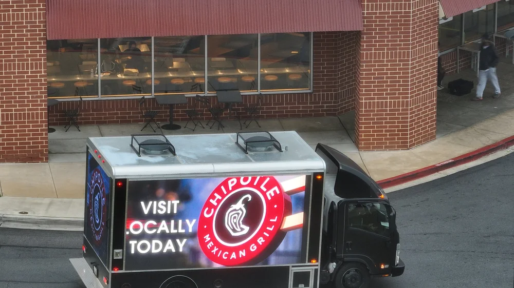 Chipotle ad on the LED truck parked outside a restaurant
