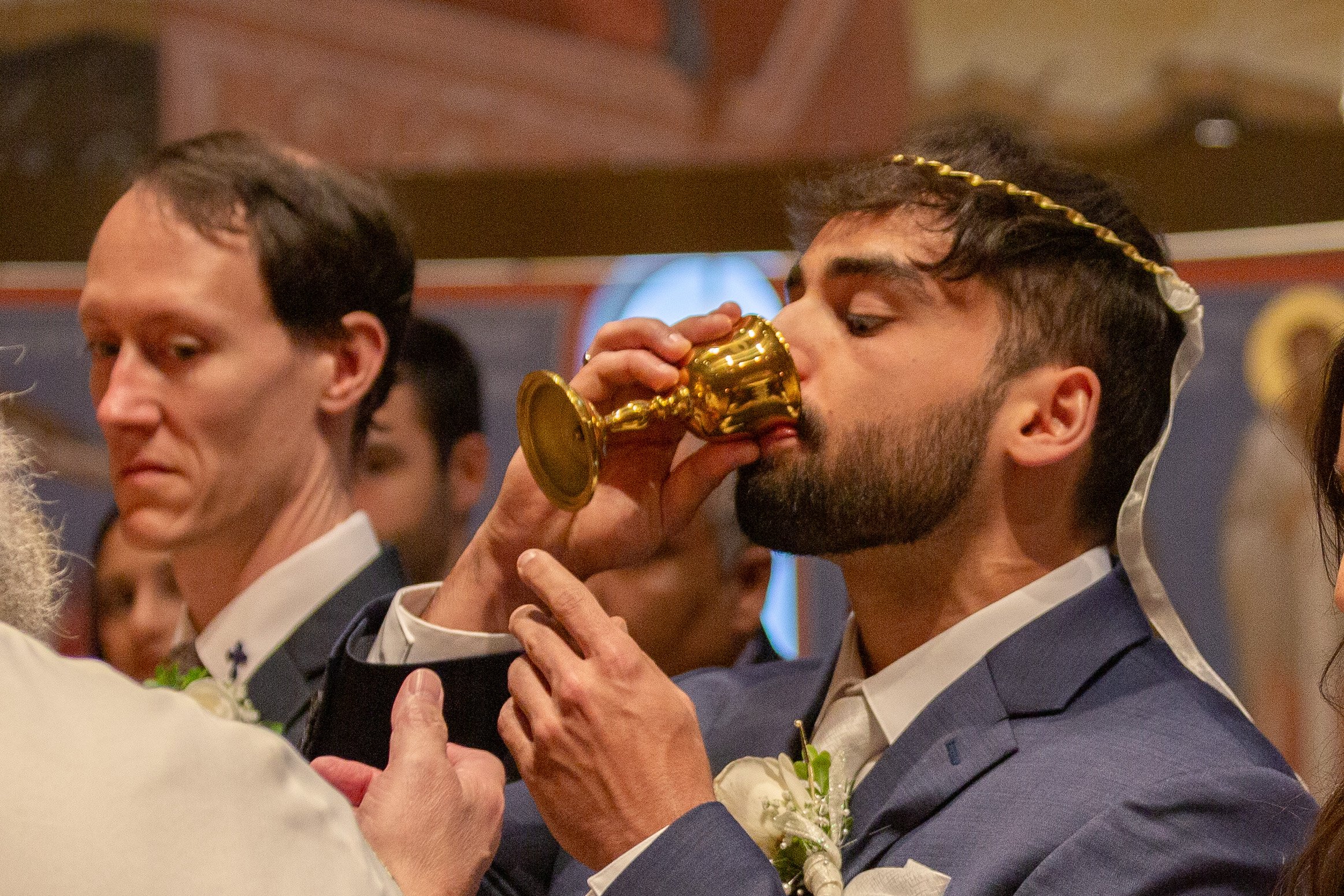 Drinking the Common Cup during Orthodox wedding service at St. Joseph Orthodox Church in Houston, TX