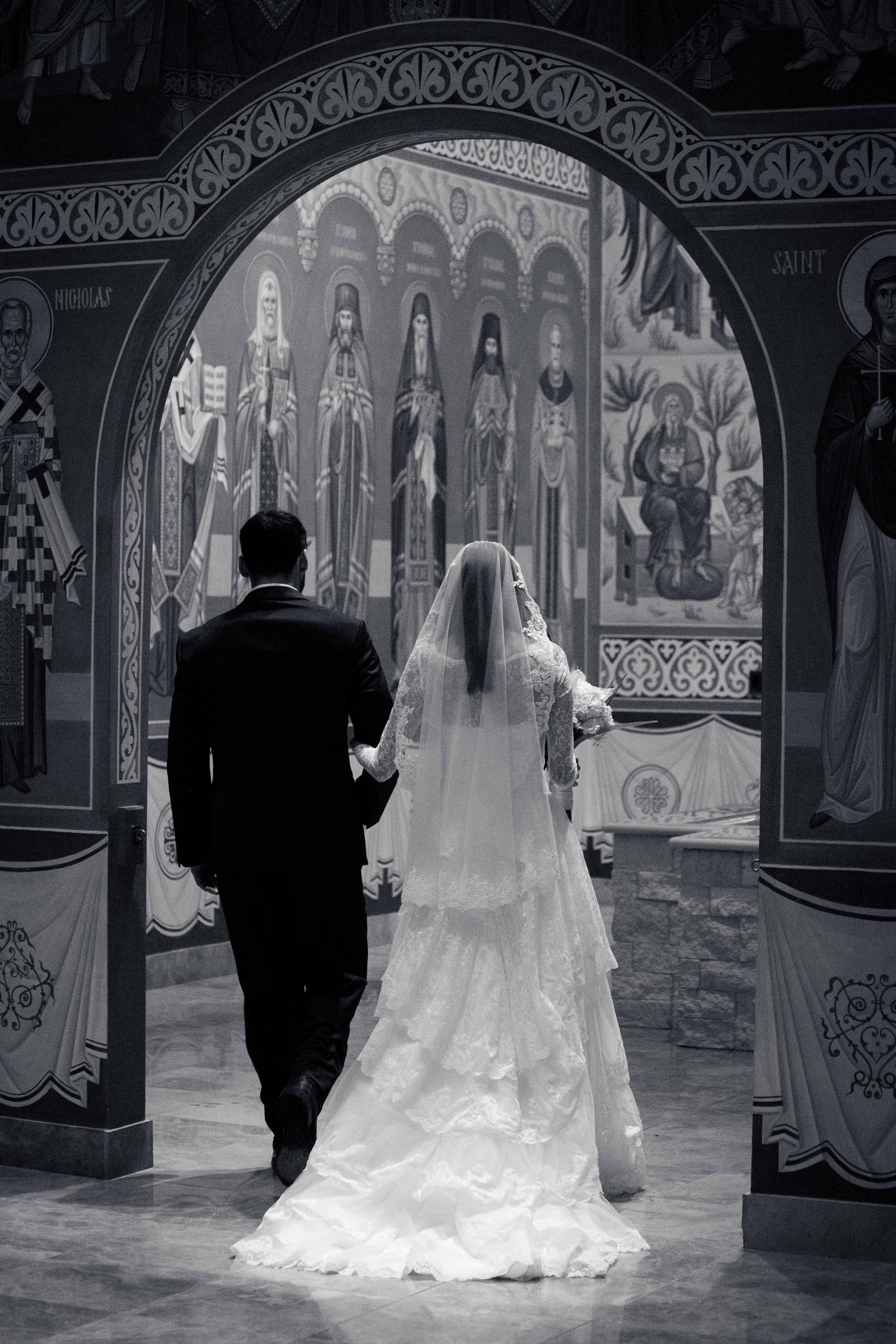 Bride and Groom leaving Orthodox wedding service at St. Joseph Orthodox Church in Houston, TX