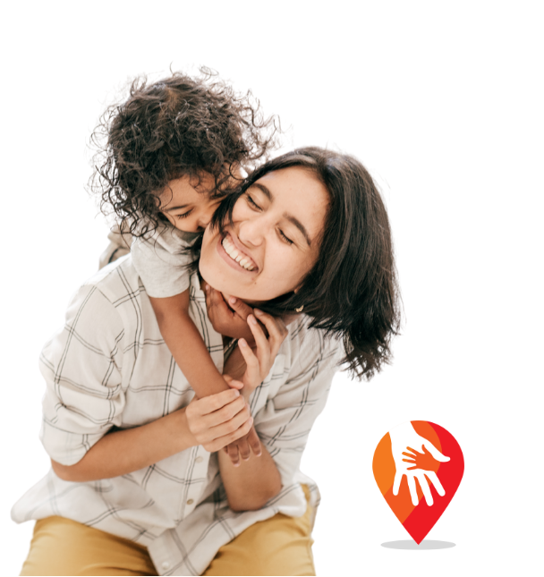 A woman and young girl sharing a joyful moment, with the girl hugging the woman from behind and both smiling. There is a red and orange Institute logo in the bottom right corner.