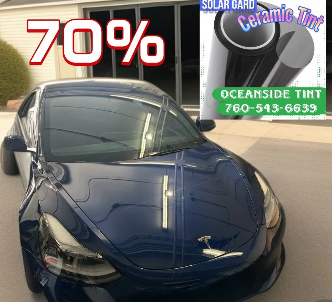 Installing ceramic IR window tint on front door glass – professional tint installation at Oceanside Tint & Glass