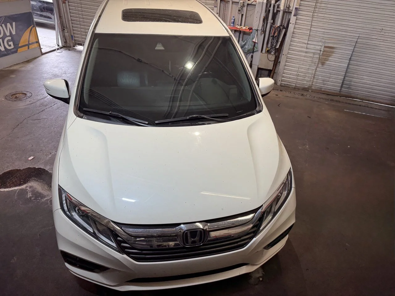 Installing ceramic IR window tint on front door glass – professional tint installation at Oceanside Tint & Glass