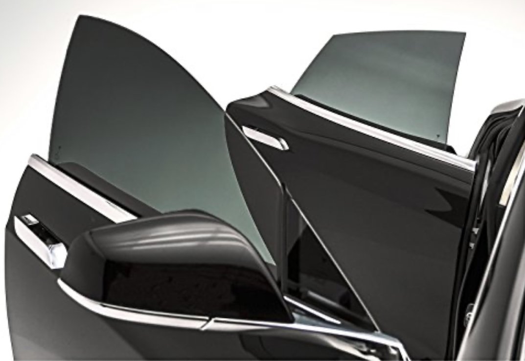 Installing ceramic IR window tint on front door glass – professional tint installation at Oceanside Tint & Glass