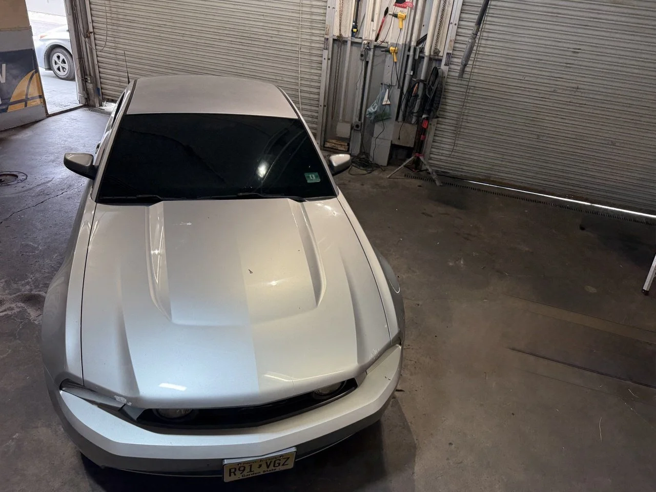 Installing ceramic IR window tint on front door glass – professional tint installation at Oceanside Tint & Glass