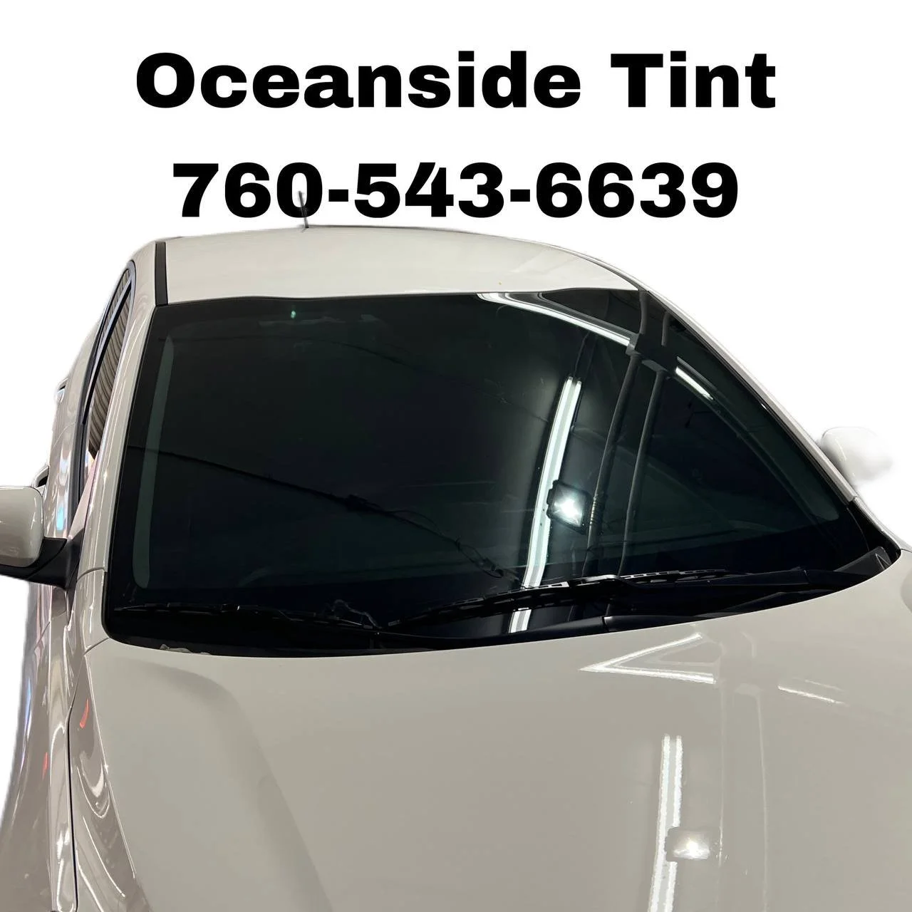 Installing ceramic IR window tint on front door glass – professional tint installation at Oceanside Tint & Glass