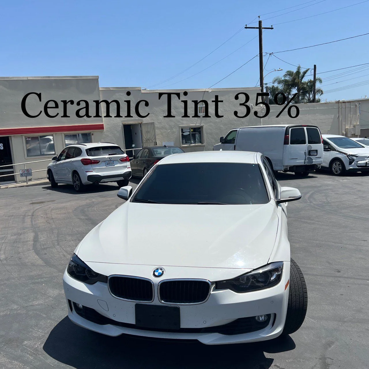 Installing ceramic IR window tint on front door glass – professional tint installation at Oceanside Tint & Glass