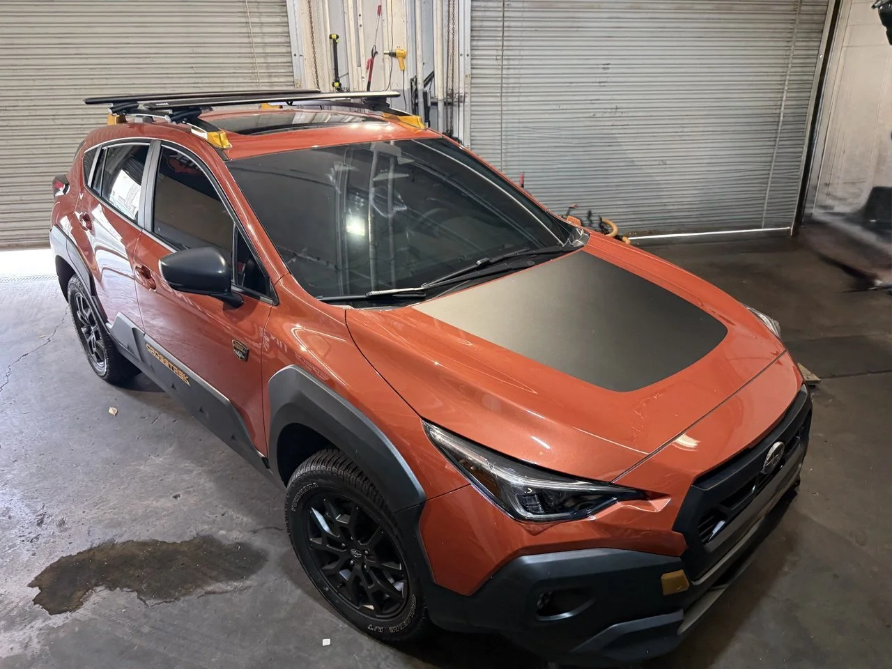 Installing ceramic IR window tint on front door glass – professional tint installation at Oceanside Tint & Glass