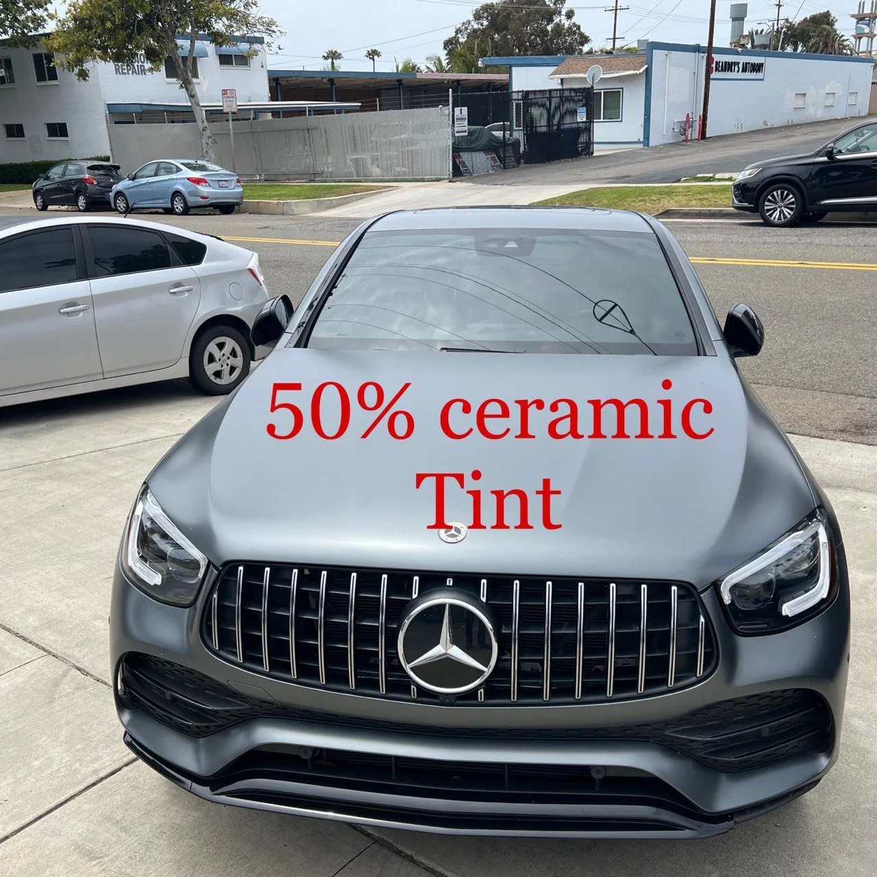 Installing ceramic IR window tint on front door glass – professional tint installation at Oceanside Tint & Glass
