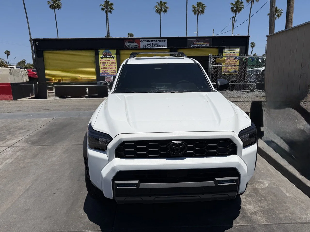 Installing ceramic IR window tint on front door glass – professional tint installation at Oceanside Tint & Glass