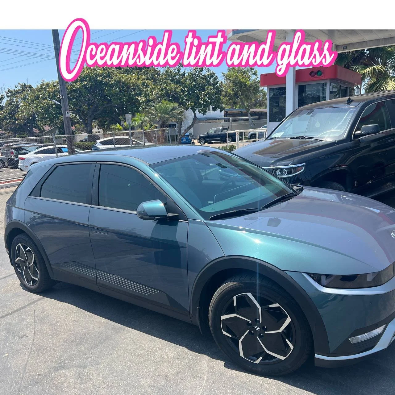 Installing ceramic IR window tint on front door glass – professional tint installation at Oceanside Tint & Glass