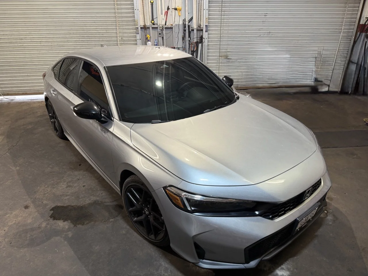 Installing ceramic IR window tint on front door glass – professional tint installation at Oceanside Tint & Glass