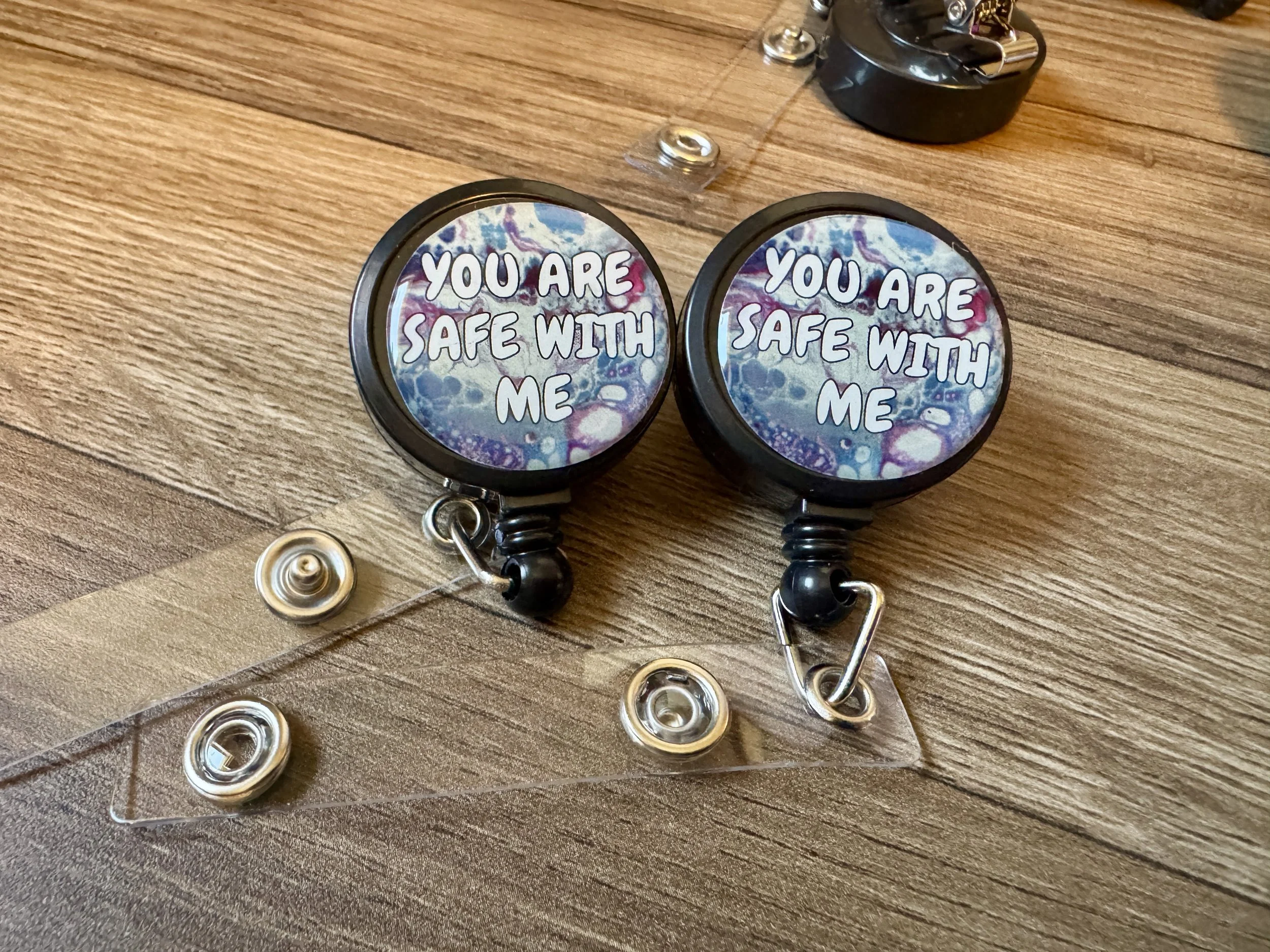 B-Grade You are Safe With Me Badge Reel - Progress Pride and Trans Pride - AbstractbyRabrams - SQ0282234