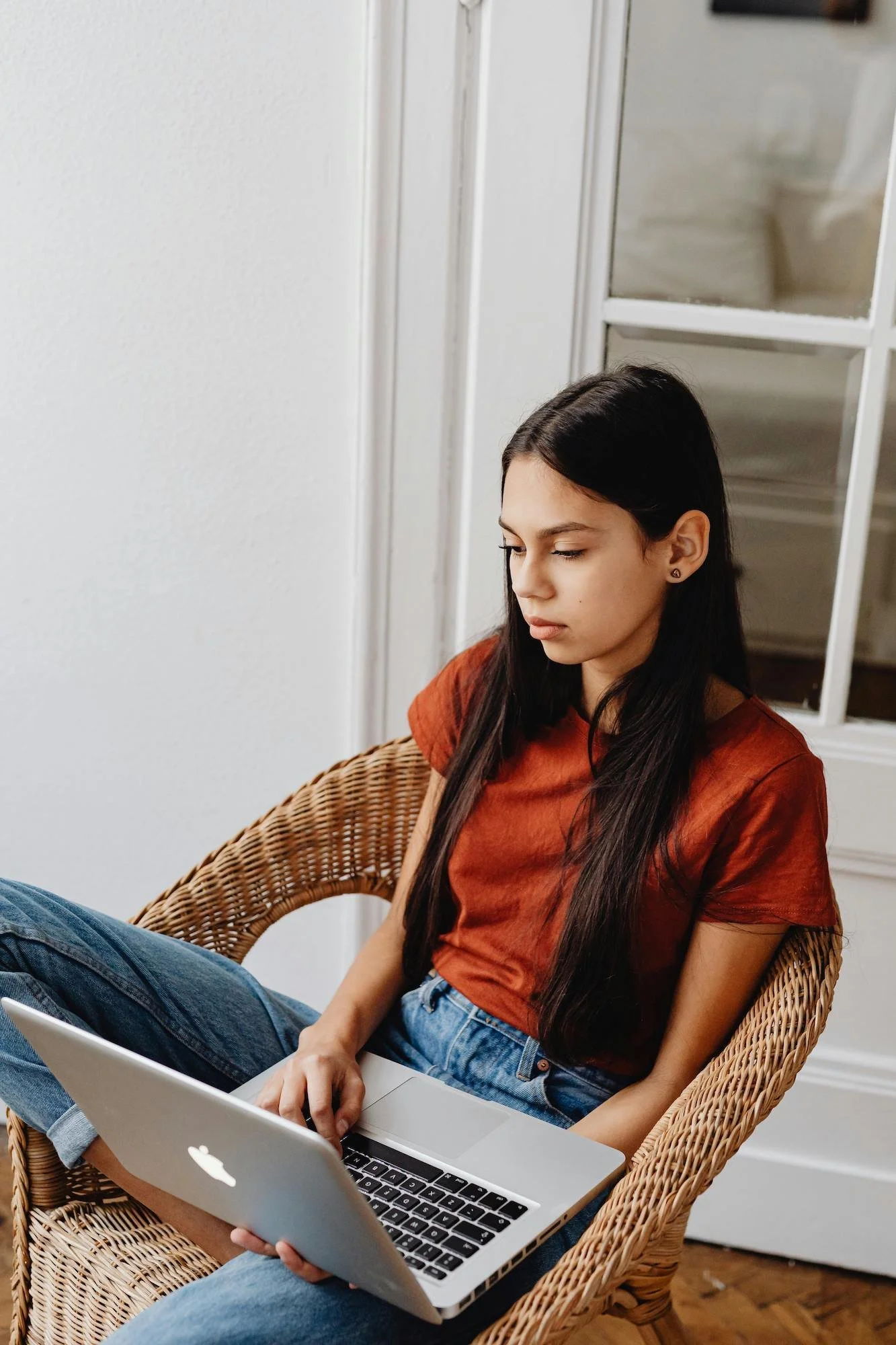 young girl looking at laptop