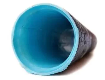A close-up of the open end of a blue plastic pipe.