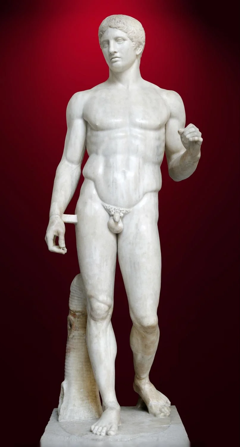 Marble Doryphoros (Spear Bearer) statue shown standing in a balanced contrapposto pose.