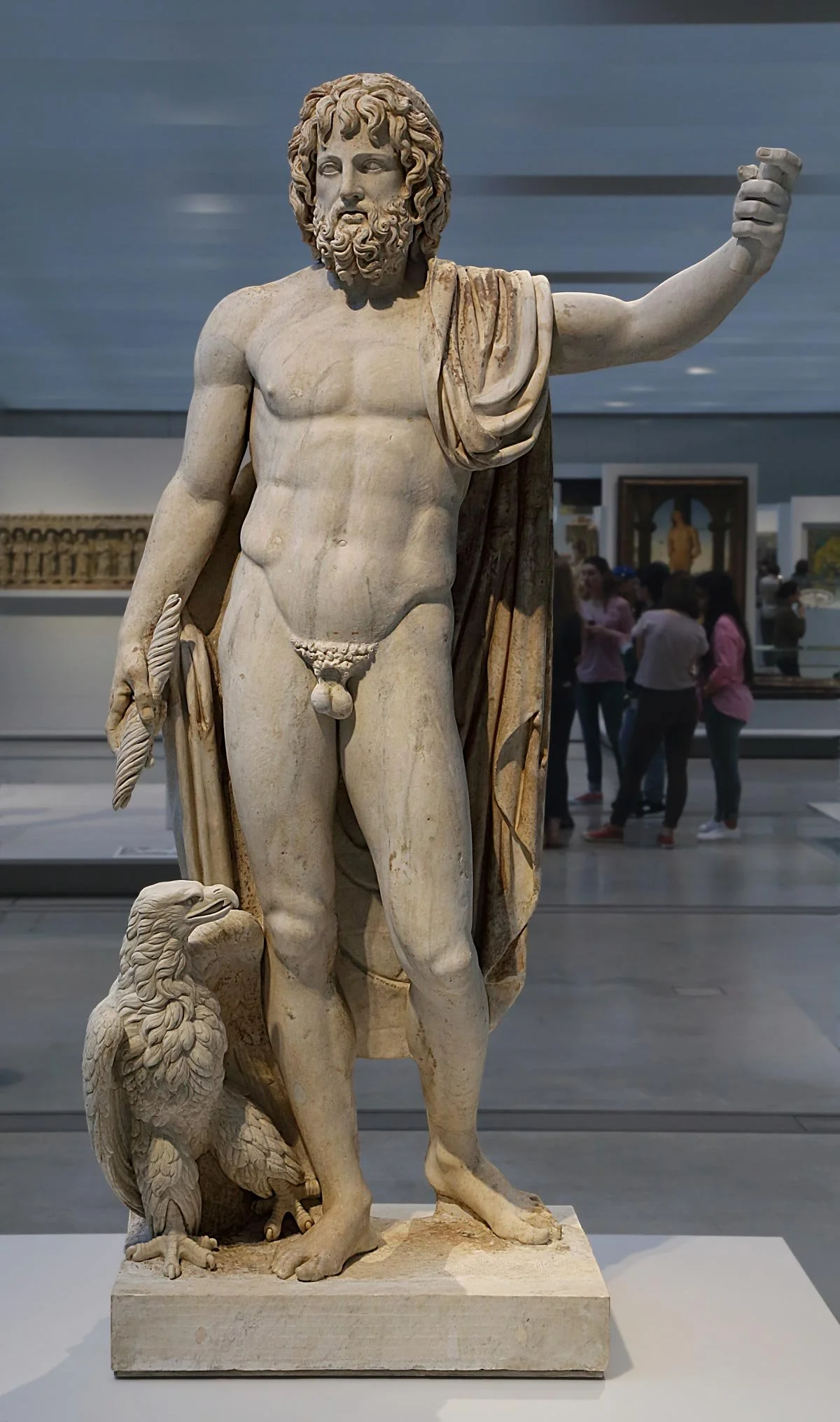 Full statue of Zeus or Jupiter standing beside an eagle.