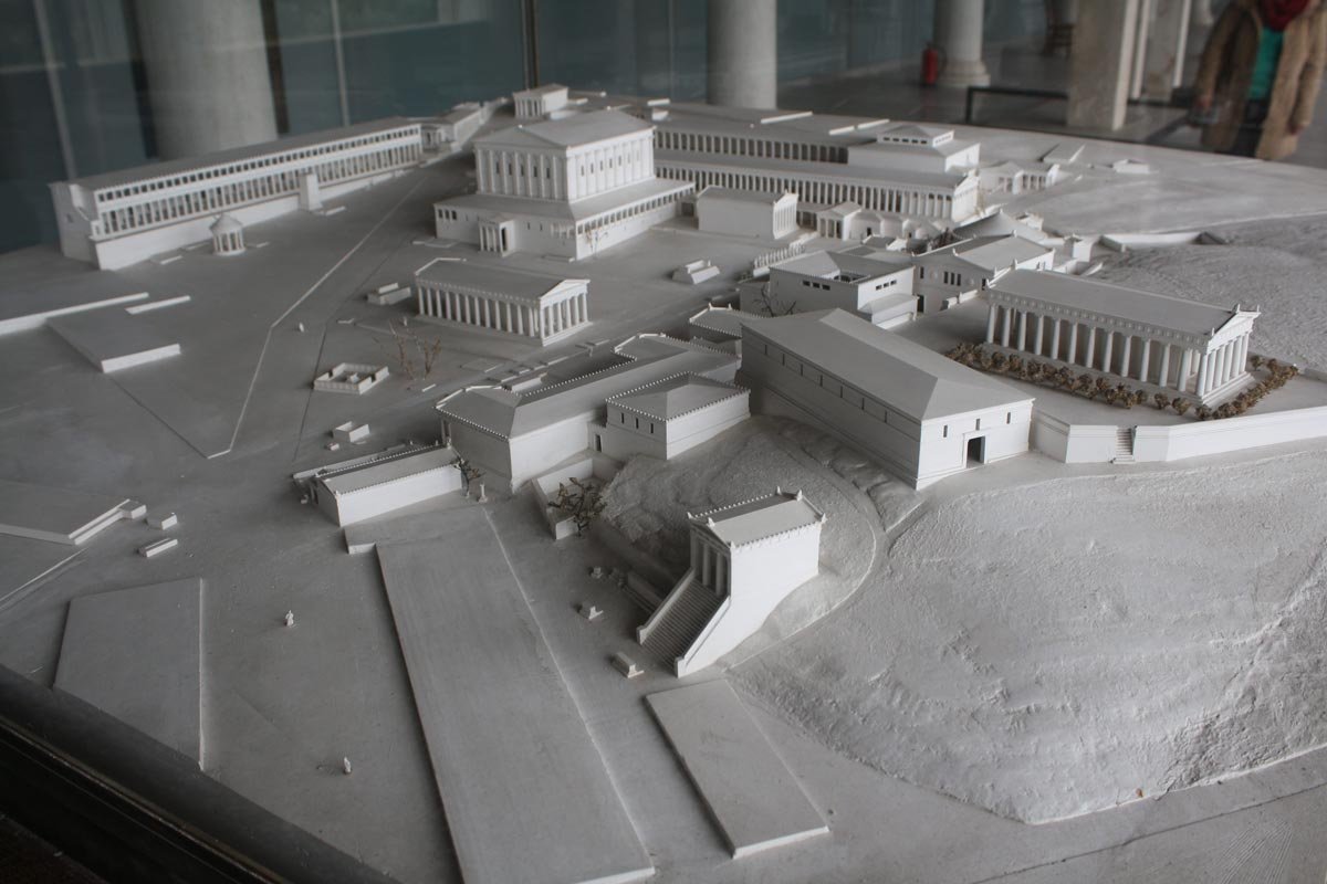 White architectural model reconstructing the Athenian Agora, showing stoas, temples and streets arranged on a raised base.