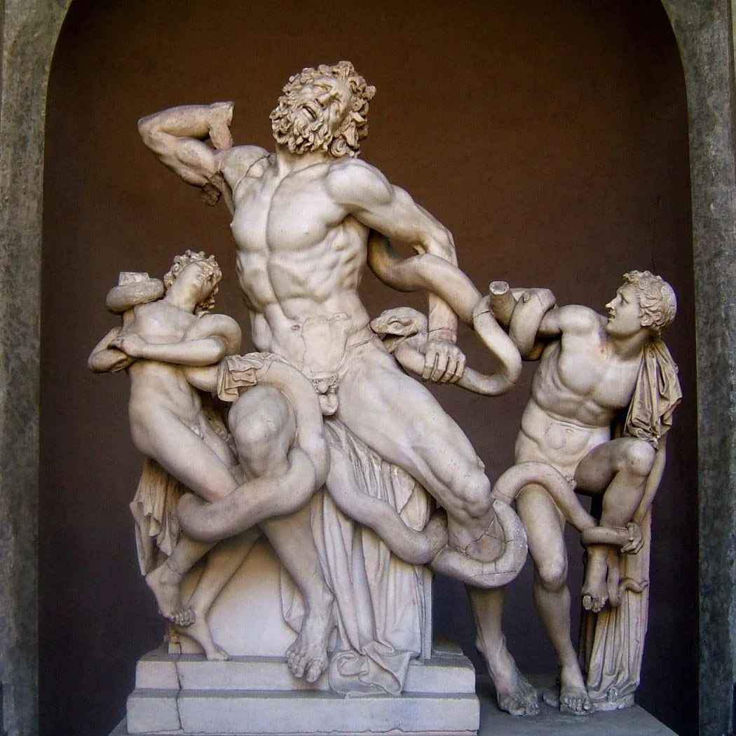 Marble group of Laocoön and his sons wrestling sea serpents, bodies twisting in intense agony within a deep stone niche.