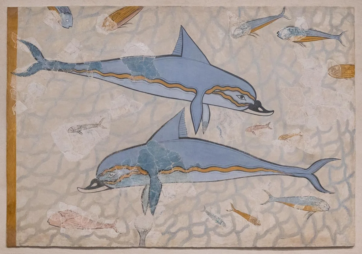 Minoan dolphin fresco with blue dolphins and fish swimming against a light background.