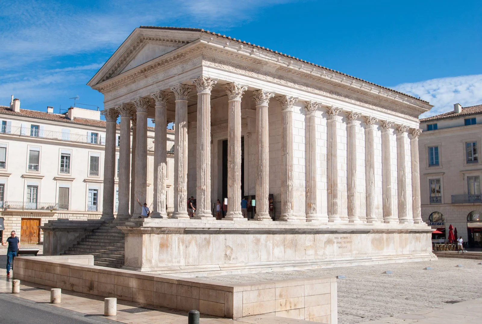 Front view of the Maison Carrée at Nîmes showing its high podium, stair, and Corinthian portico.