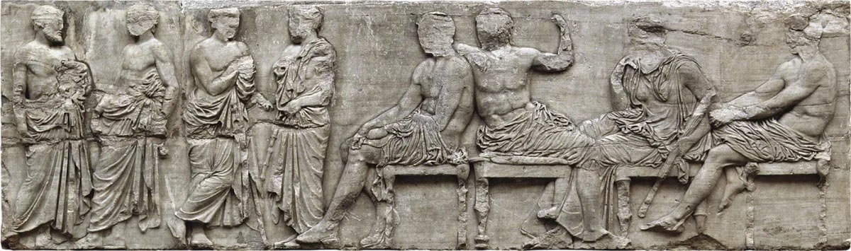 Relief slab from the Parthenon frieze with standing and seated figures.