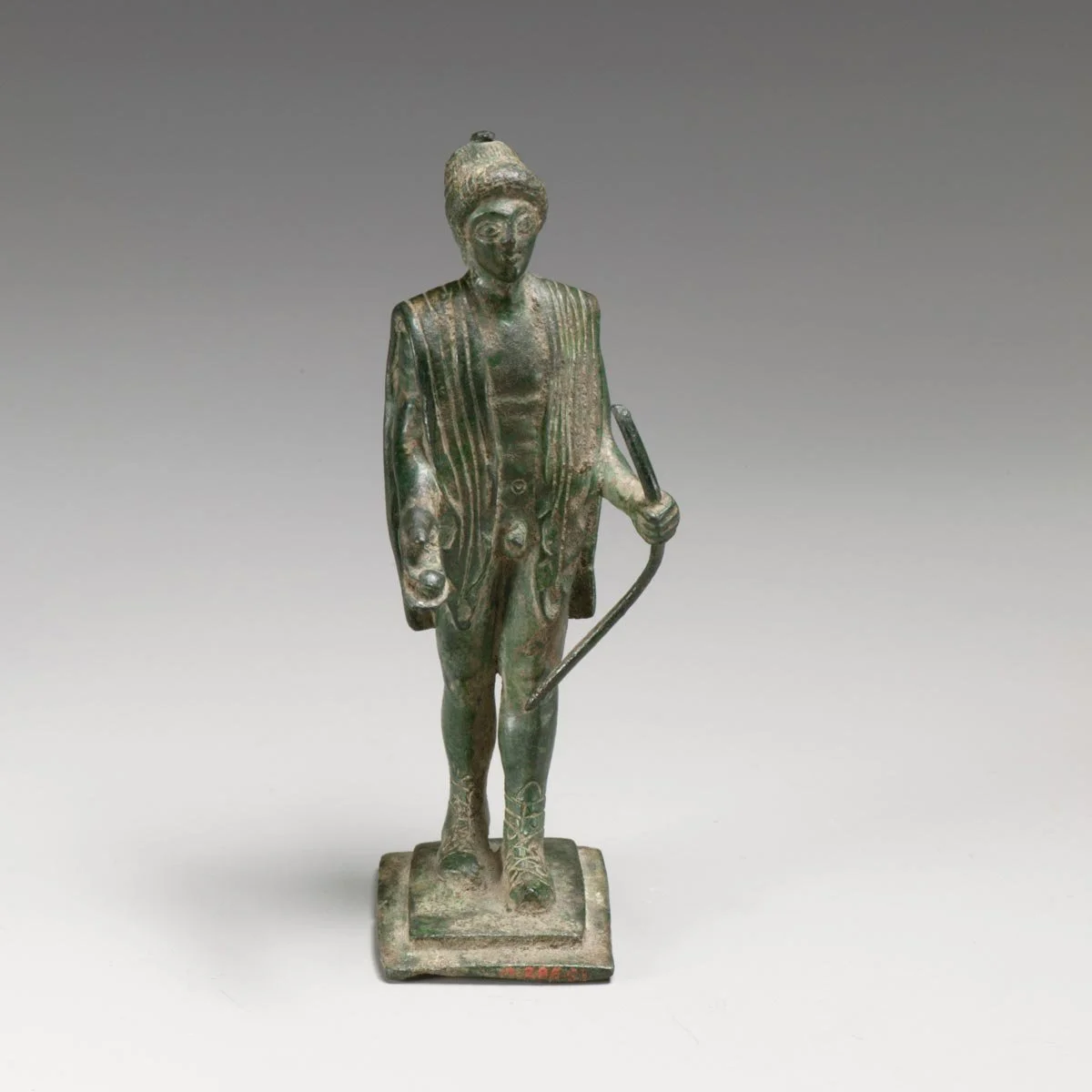 Small bronze statuette of Apollo standing with a youthful nude body.