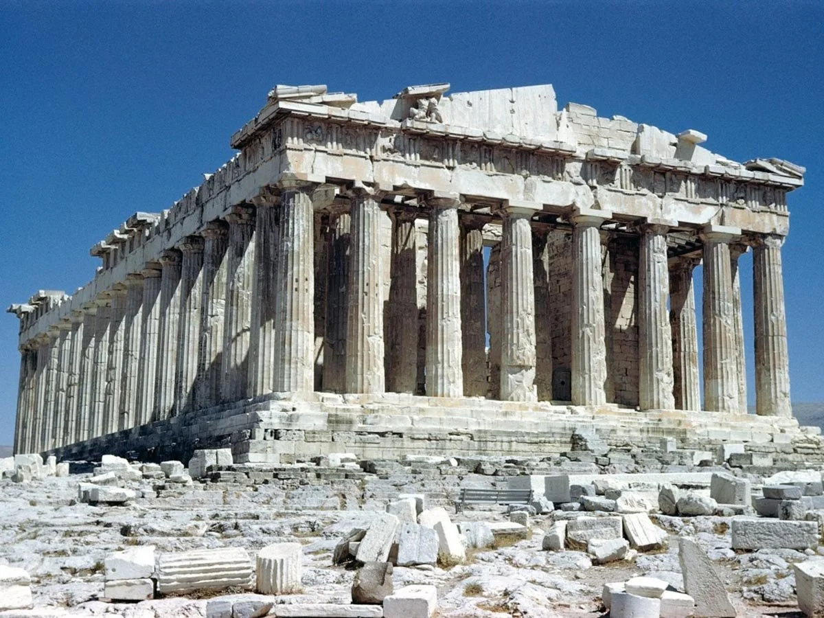 Exterior view of the Parthenon from an angled side perspective.