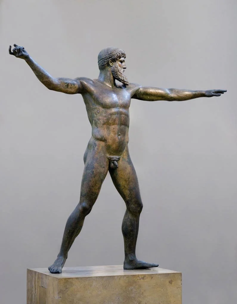 Bronze god statue with outstretched arms, often debated as Zeus or Poseidon.