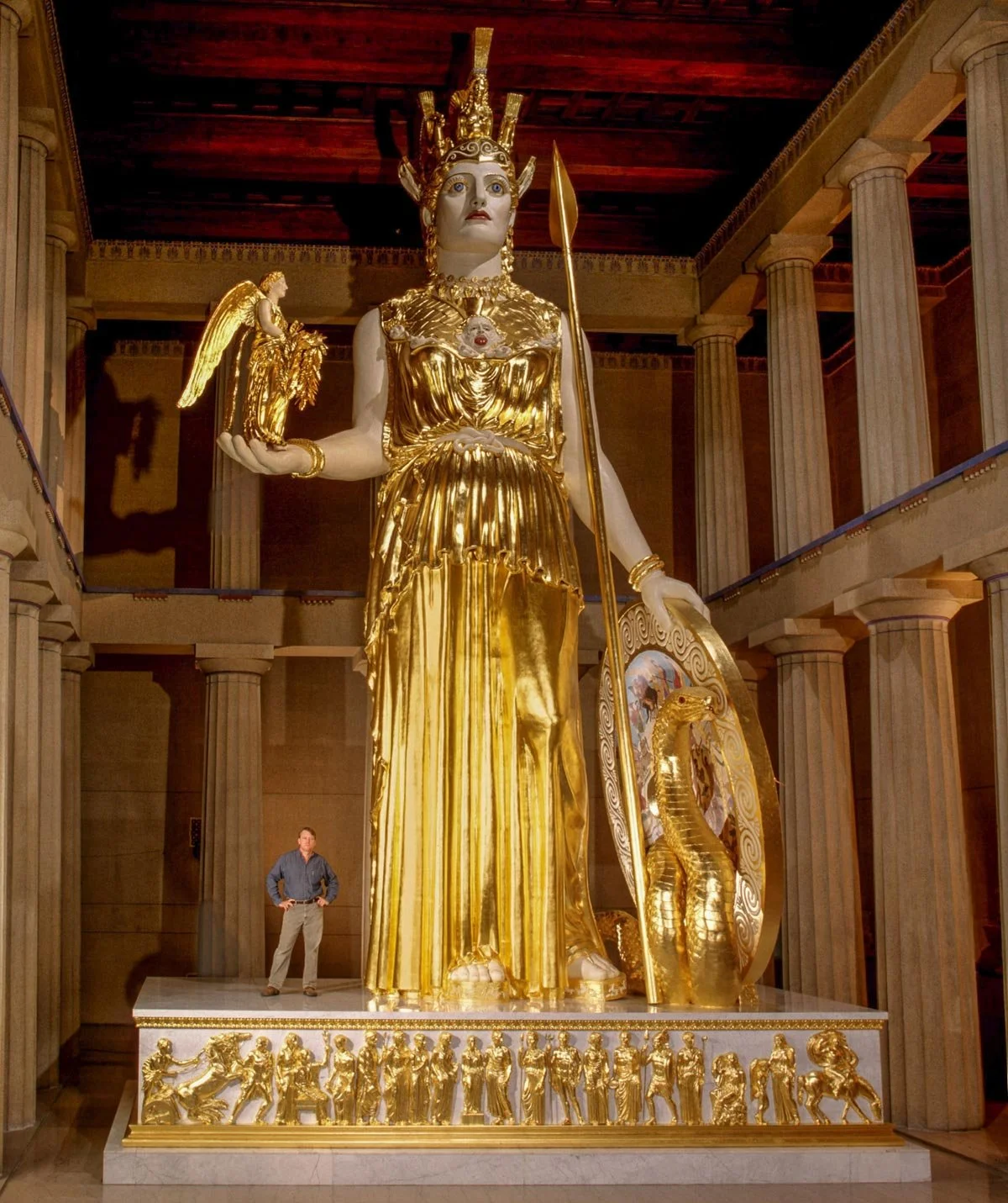 Full modern reconstruction of Athena Parthenos standing inside a columned interior.