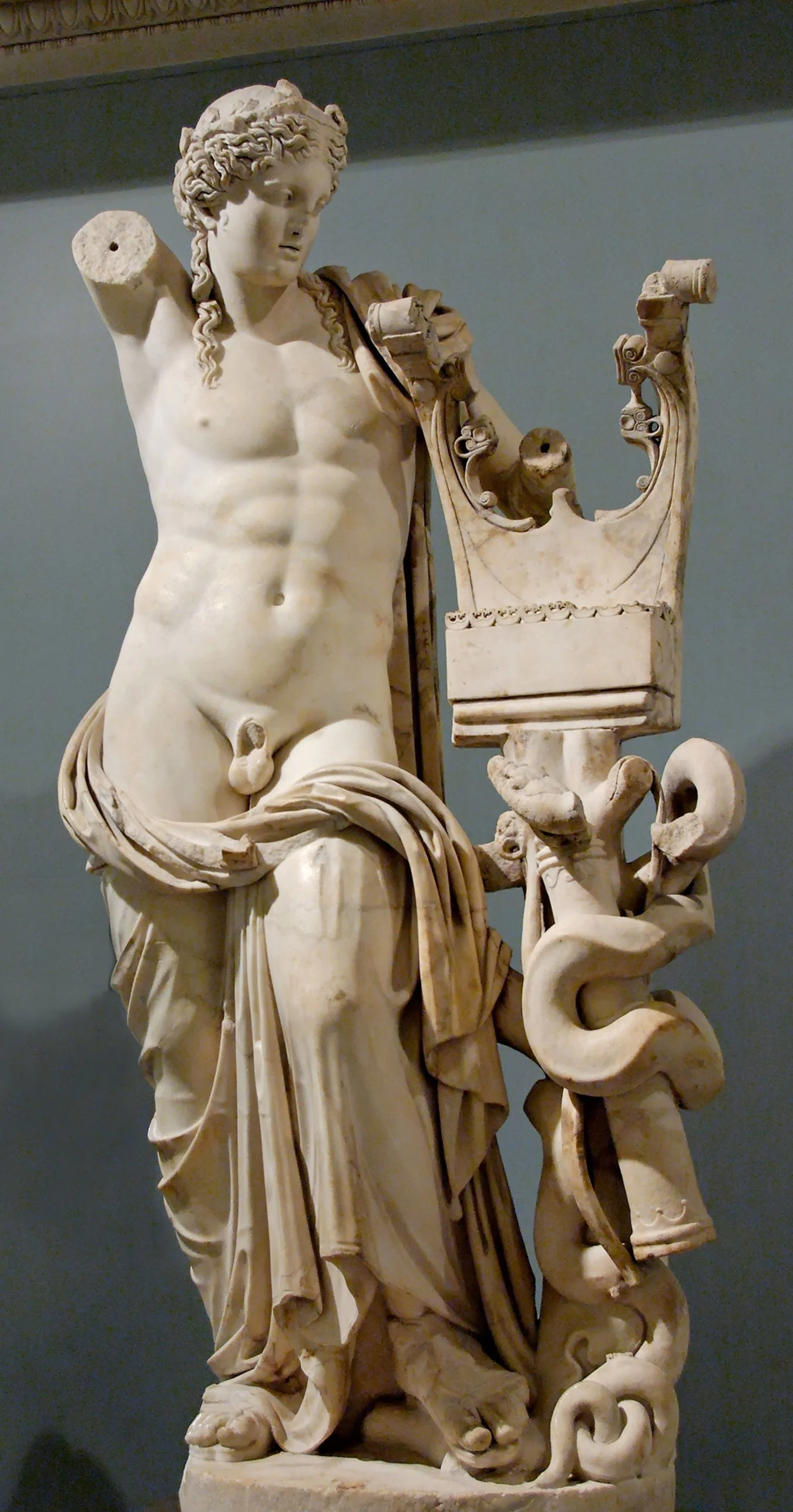 Marble statue of Apollo beside a kithara support.