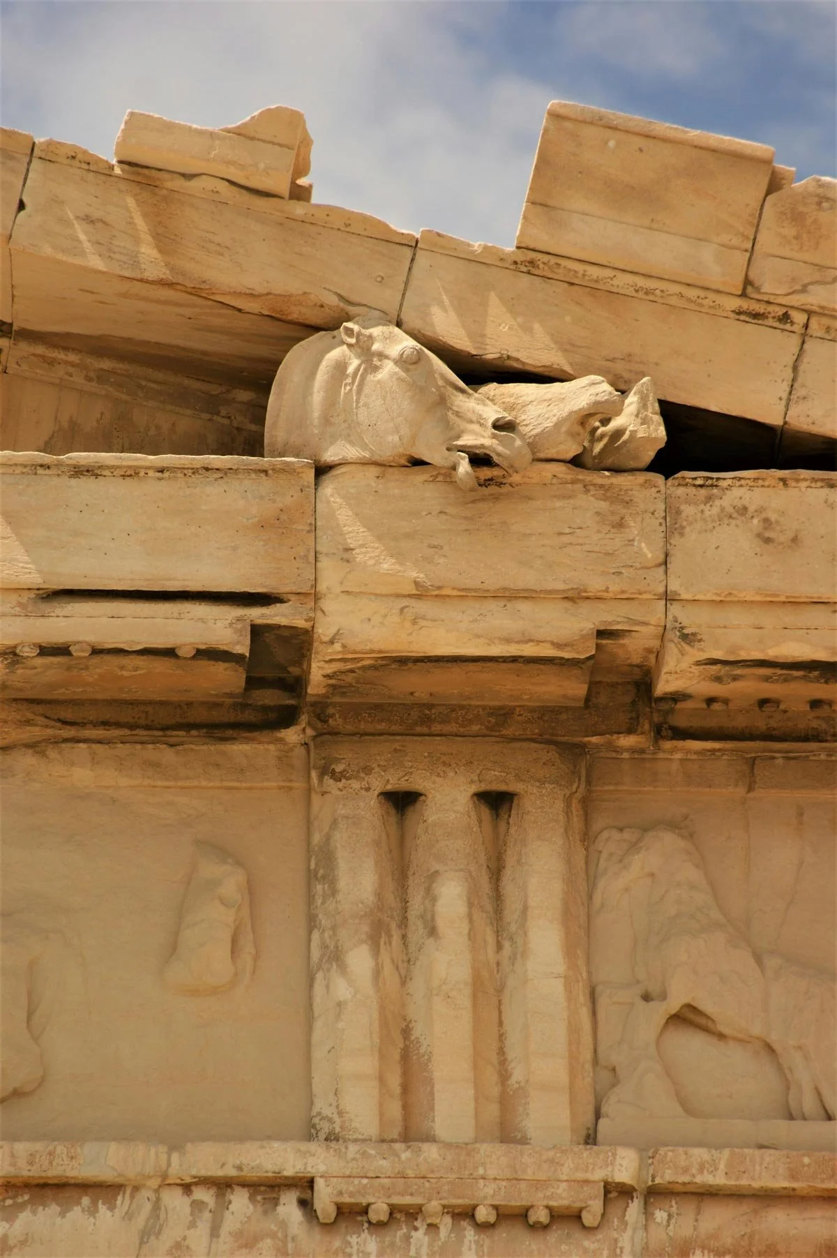 Horse-head sculpture fragment still visible high on the Parthenon.