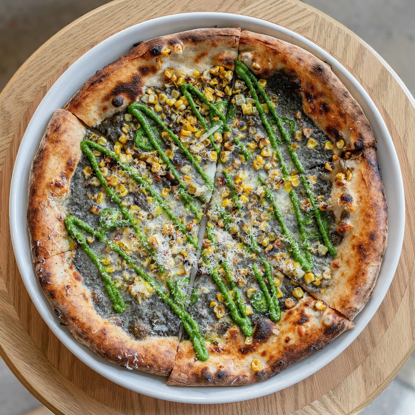 New for fall&mdash;corn pizza with sweet corn, huitlacoche cream, jalape&ntilde;o, and cilantro pepita pesto.