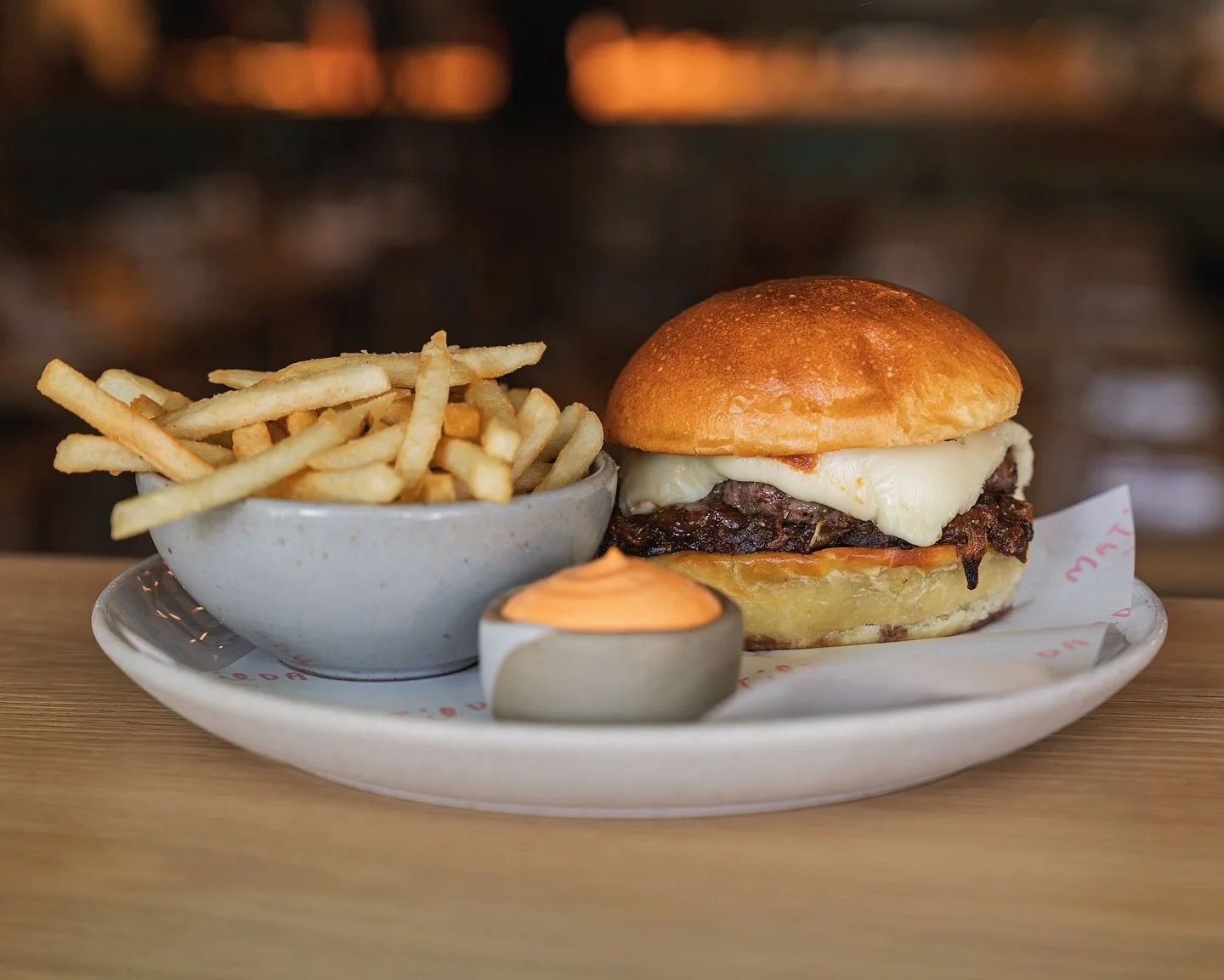 Every Tuesday is Burger Night at Matilda.
The Matilda Bone Marrow Burger&mdash;dry-aged wagyu, bone marrow, house-made umami cheese, caramelized onions on a @redbicyclebread potato bun. Served with fries and some burger night drink specials.