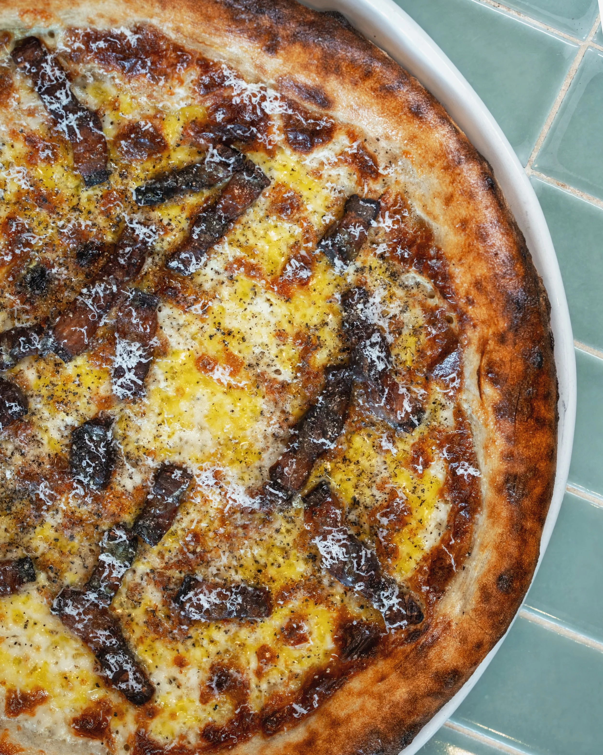 The Carbonara pizza, new on our fall menu. 

Guanciale, pecorino cream, egg yolk, shallot, black pepper. All on our house-made sourdough crust.