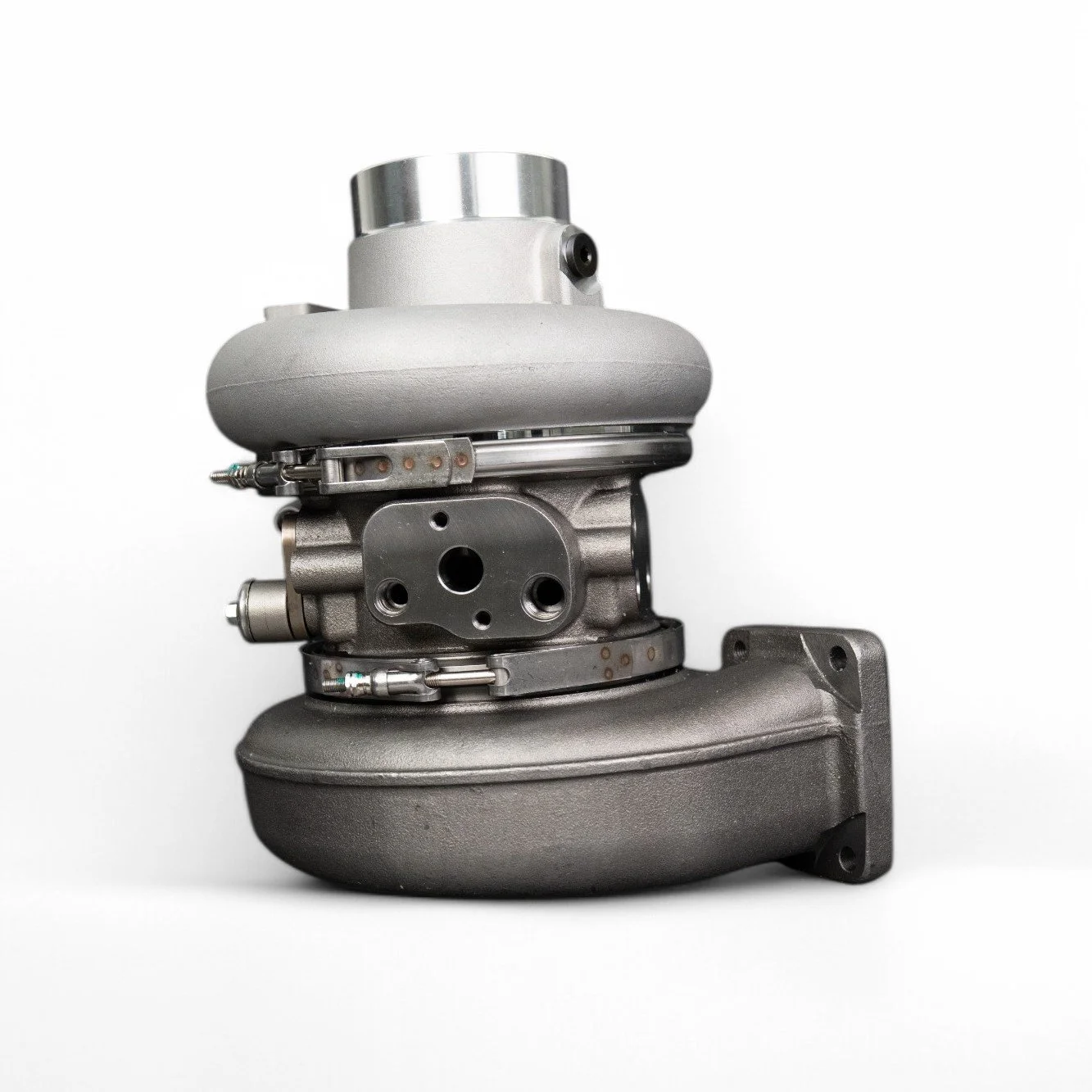 A close-up of a turbocharger against a white background.