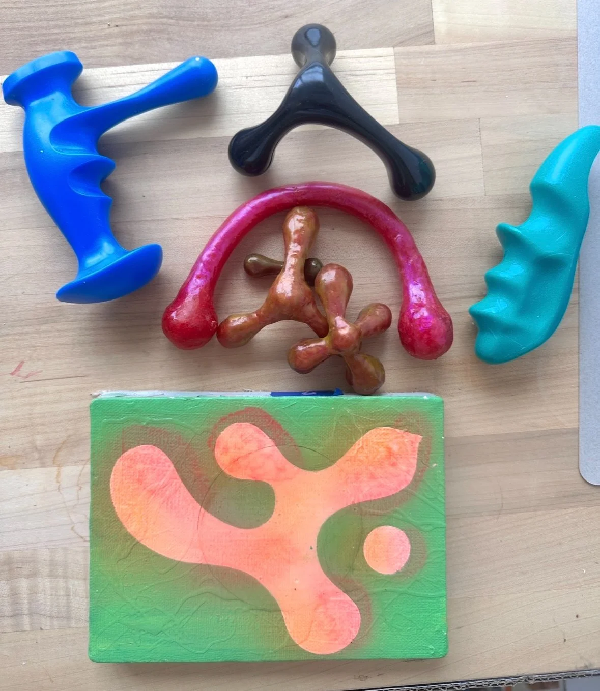 Series: Wax Sculptures, 2025 Red cheese wax, gold foil, pre-made hand massagers, UV Nail gel, clay, paint and pigments