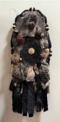 Image: Bryan Keith Thomas,  “Legacy”, Medium - velvet , antique silk, heirloom bags, 19th century African- American photo brooch, bone, acrylic and oil on wood, 10” x 27” x 4”.