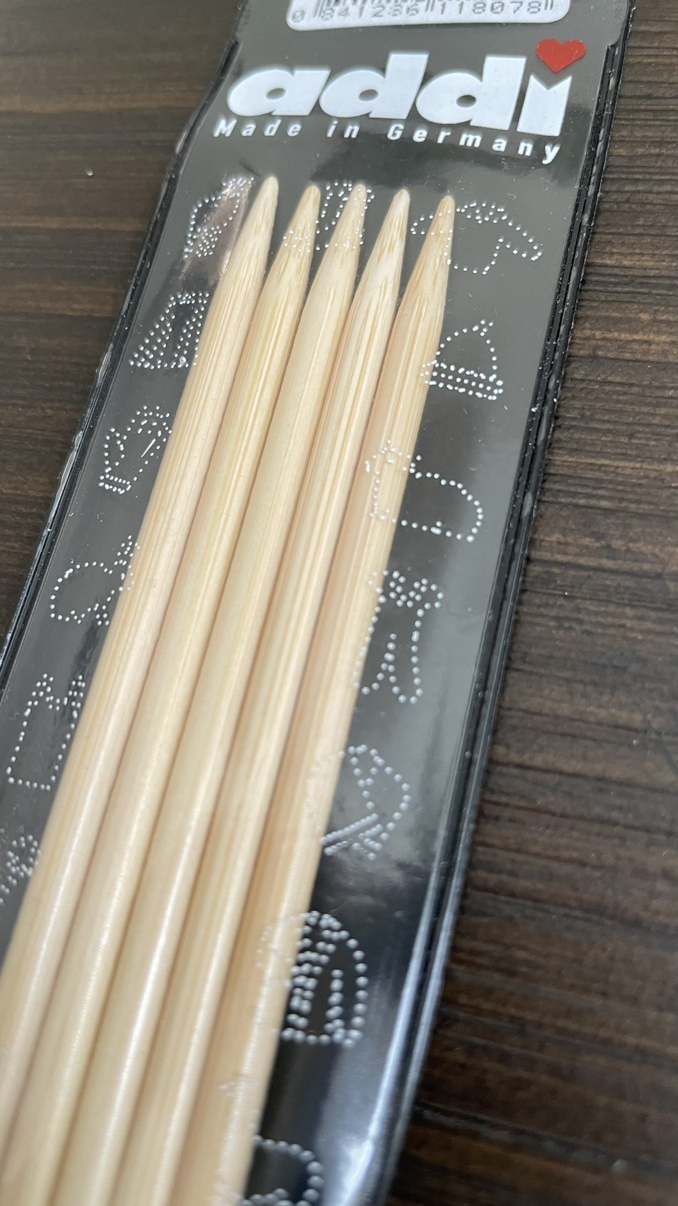 Top view of Addi 8-inch bamboo double-pointed needles in their packaging.