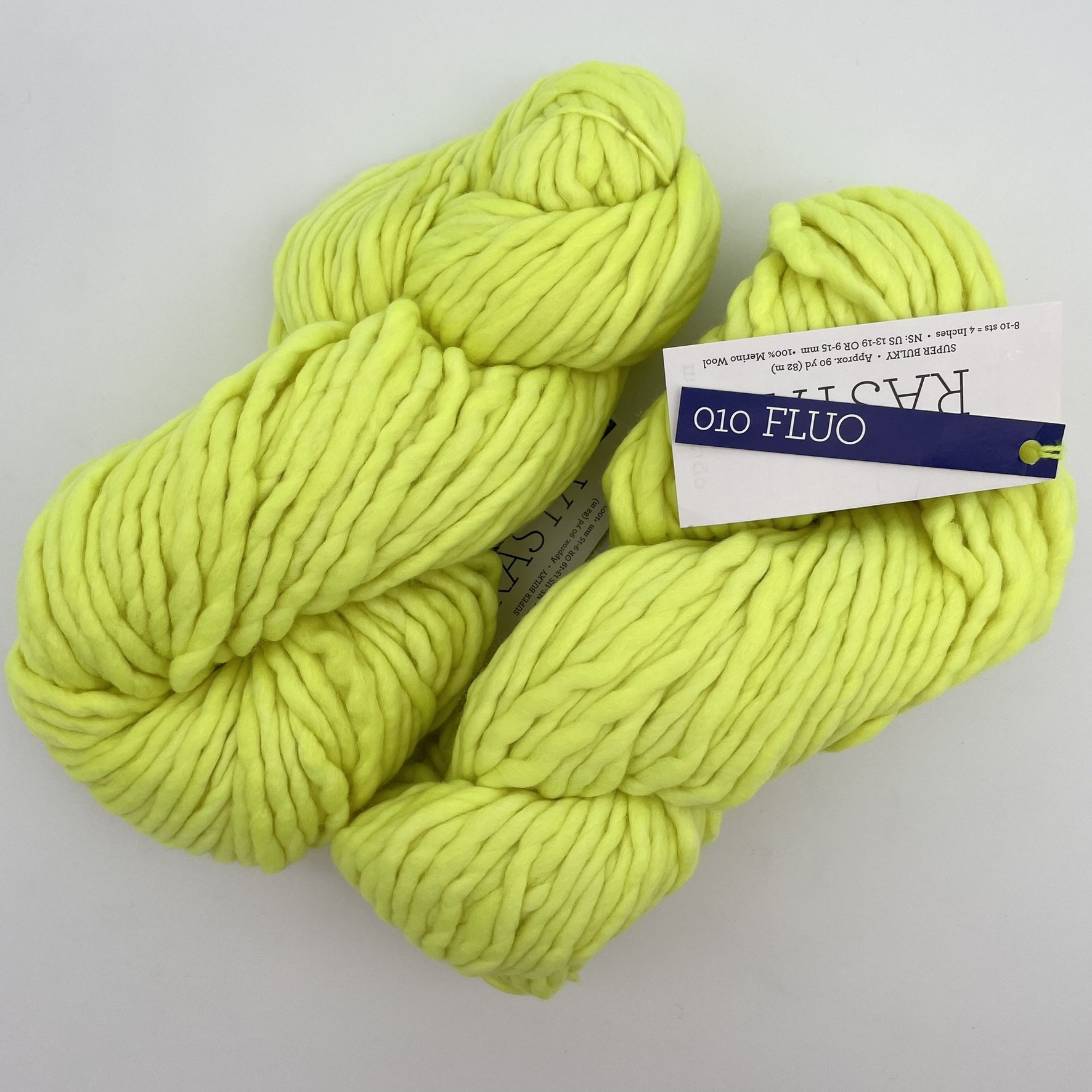 Malabrigo Rasta yarn in Fluo colorway, a bright neon yellow super bulky merino wool skein perfect for vibrant knitting or crochet projects.