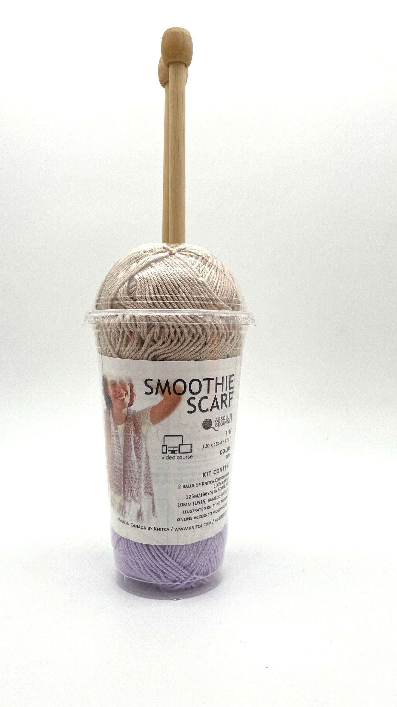 DIY Smoothie Scarf Knitting Kit by Knitca featuring tan and purple yarn, front view with wooden knitting needles in a plastic cup.