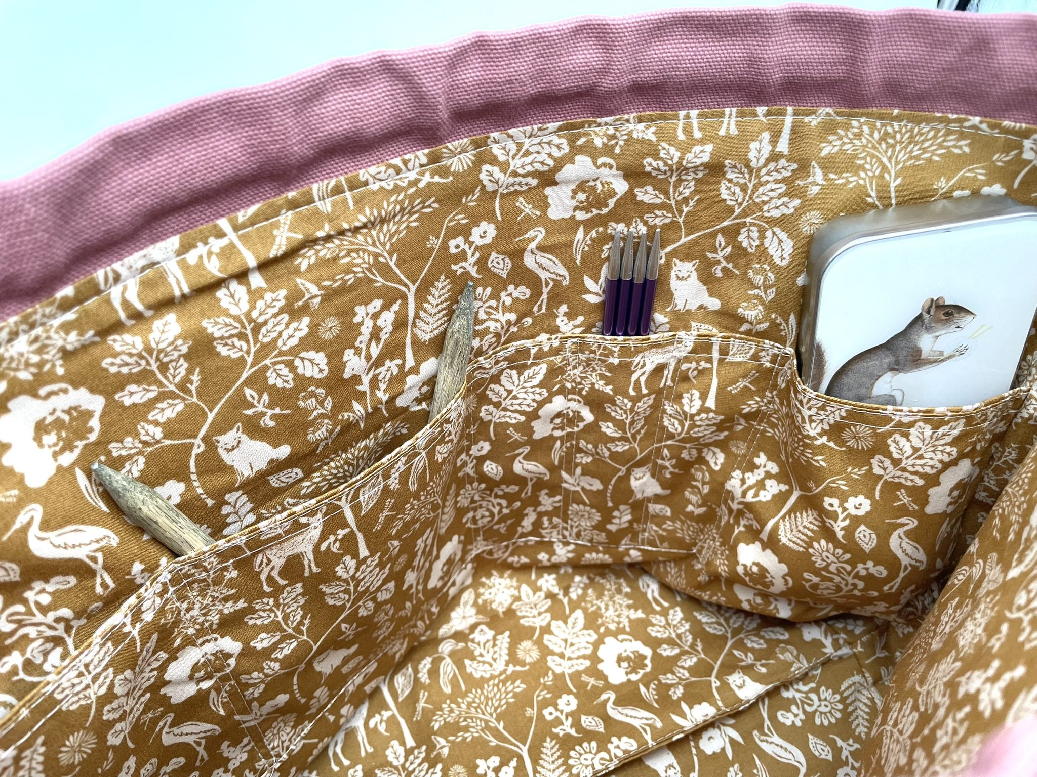 Close-up of inside pockets in large pink Puff Stitch project bag